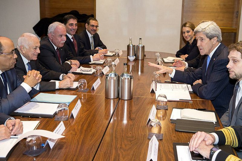 US Secretary of State John Kerry, second right, meets with Arab League secretary general Nabil El-Arabi, second from left, on Tuesday, Dec. 16, 2014, in London. The meeting was to discuss the ongoing peace process between the Israelis and Palestinians. (AP Photo/Evan Vucci, Pool)