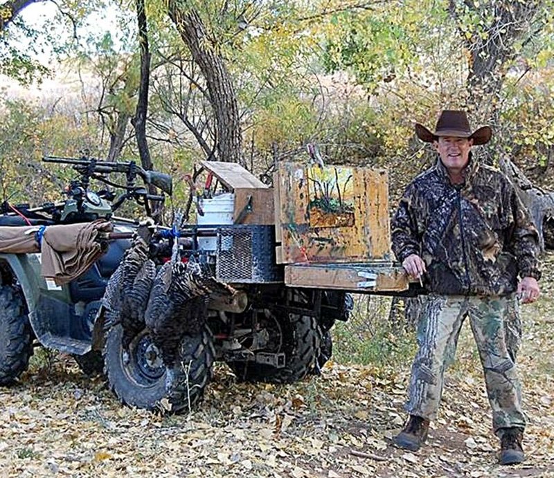 Pat Matthews of Little Rock carries a portable art studio into the hunting woods on his four-wheeler. 