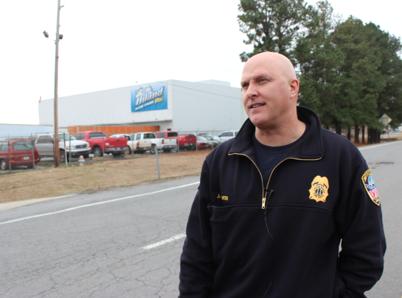 Little Rock Fire Capt. Jason Weaver speaks to reporters Wednesday outside Hiland Dairy.