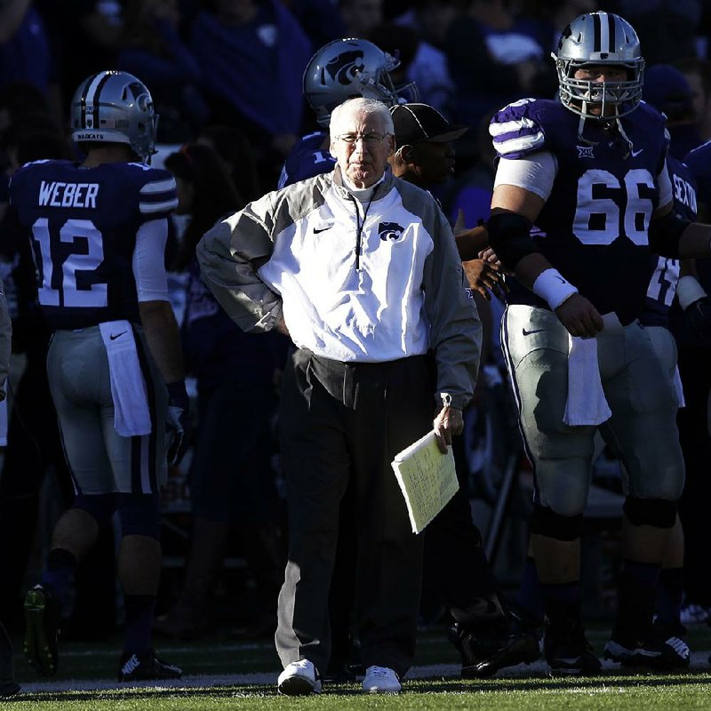 Kansas State Coach Bill Snyder (center) doesn’t put much stock in Twitter or text messages, instead staying in contact the old-fashioned way: through letters he sends out to opponents after every game. 