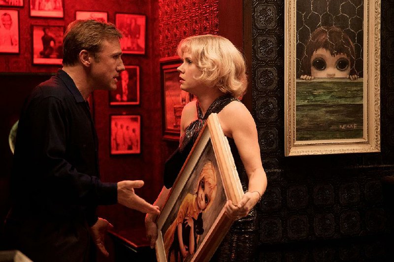 Walter (Christoph Waltz) and Margaret Keane (Amy Adams) argue over the provenance of the paintings that made them millions in Tim Burton’s comedy Big Eyes.