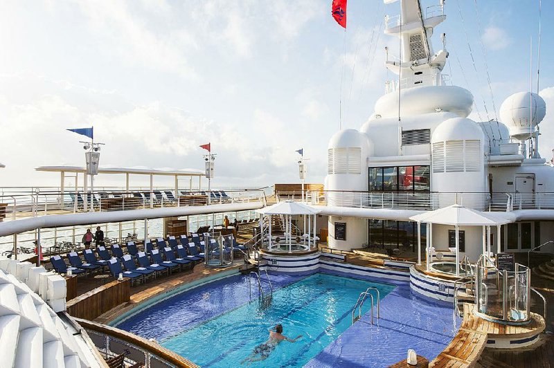 Reserved exclusively for guests 18 and older, Quiet Cove Pool on the Disney Magic is a retreat for adults to relax and unwind. In this multi-level pool, adults can fully immerse themselves in a tranquil environment to soak up the sun, bask in warm tropical breezes or enjoy a beverage at the poolside bar. (Matt Stroshane, photographer) 