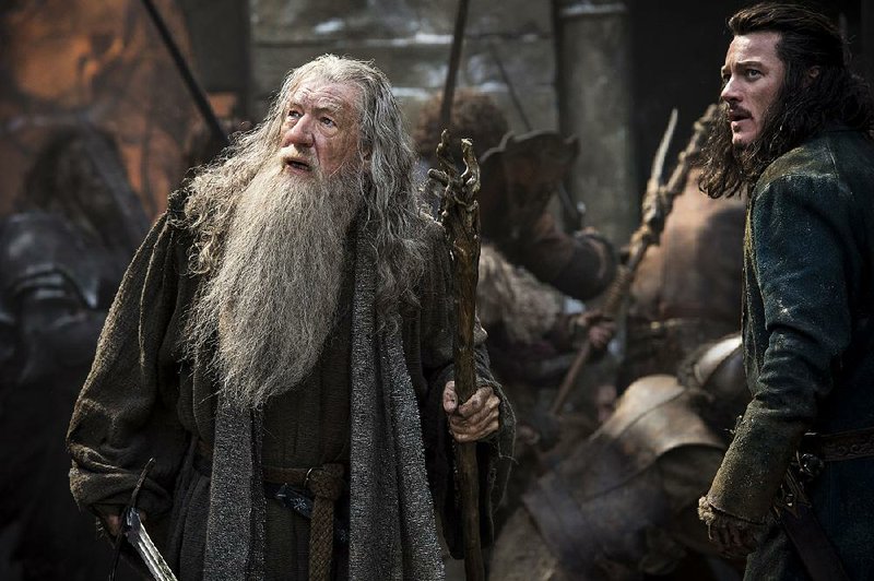 Ian McKellen (left) and Luke Evans star in The Hobbit: The Battle of the Five Armies. It came in first at last weekend’s box office and made about $90 million since opening Dec. 17.