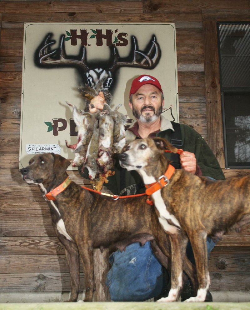 Out1228
Arkansas Democrat-Gazette/BRYAN HENDRICKS
Tim Weaver of Melbourne, judge for the 18th judicial circuit in north Arkansas, displays some of the squirrels he and the writer bagged Tuesday with the help of Weaver's dogs Ella and Roxie.