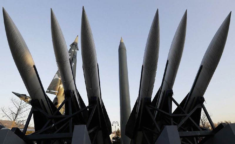 A North Korea's mock Scud-B missile, center, and other South Korean missiles are display at Korea War Memorial Museum in Seoul, South Korea, Friday, Dec. 26, 2014. South Korea, the U.S. and Japan will sign their first-ever trilateral intelligence-sharing pact next week to better cope with North Korea's increasing nuclear and missile threats, Seoul officials said Friday. (AP Photo/Ahn Young-joon)