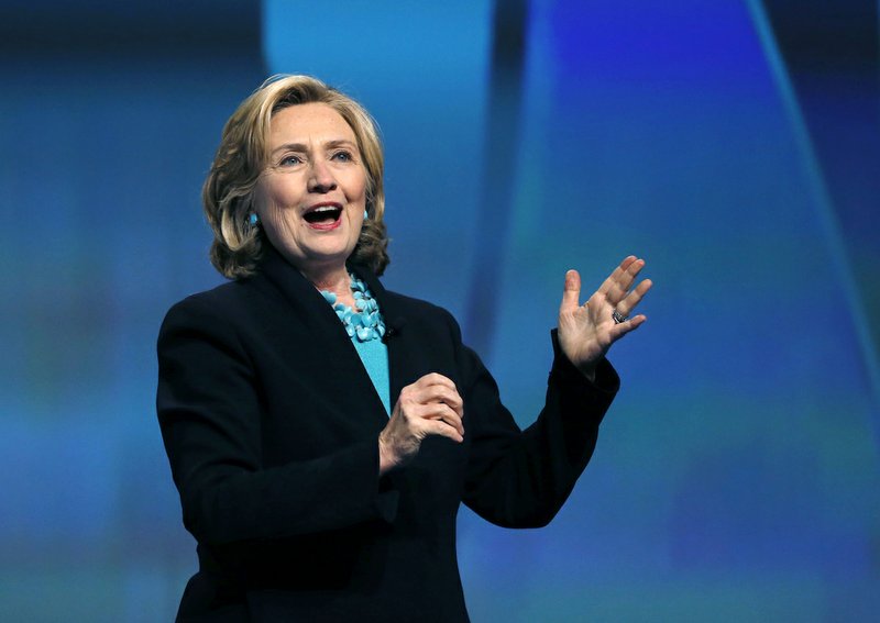 This Dec. 4, 2014, file photo shows former Secretary of State Hillary Rodham Clinton speaking at the Massachusetts Conference for Women in Boston. 