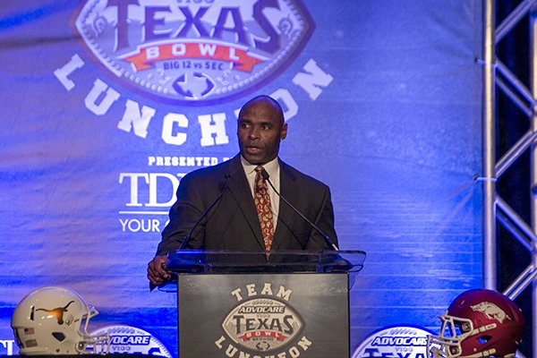 Texas coach Charlie Strong speaks during a luncheon Saturday, Dec. 27, 2014 at the Westin Galleria hotel in Houston. 