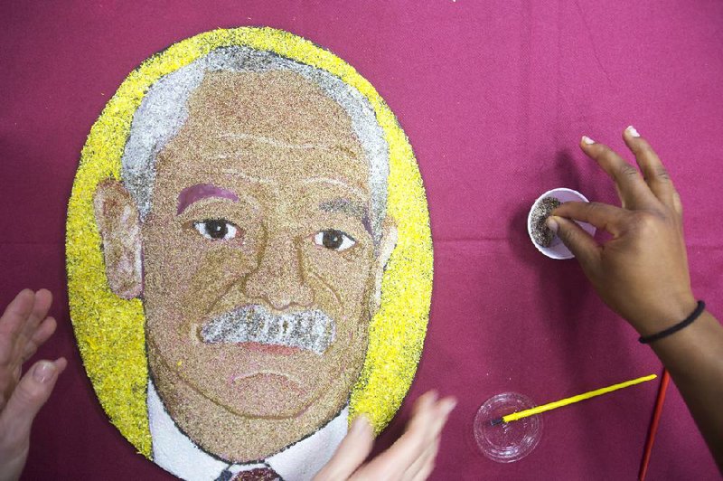 Arkansas Democrat-Gazette/MELISSA SUE GERRITS - 12/05/2014 - A floragraph, a portrait of Michael Weadock, made out of flowers is finished December 5, 2014 at the Veterans Hospital in Little Rock. The florograph will be attached to the Donate Life float at the January 1st Rose Parade that honors organ donors for their gift of life. 