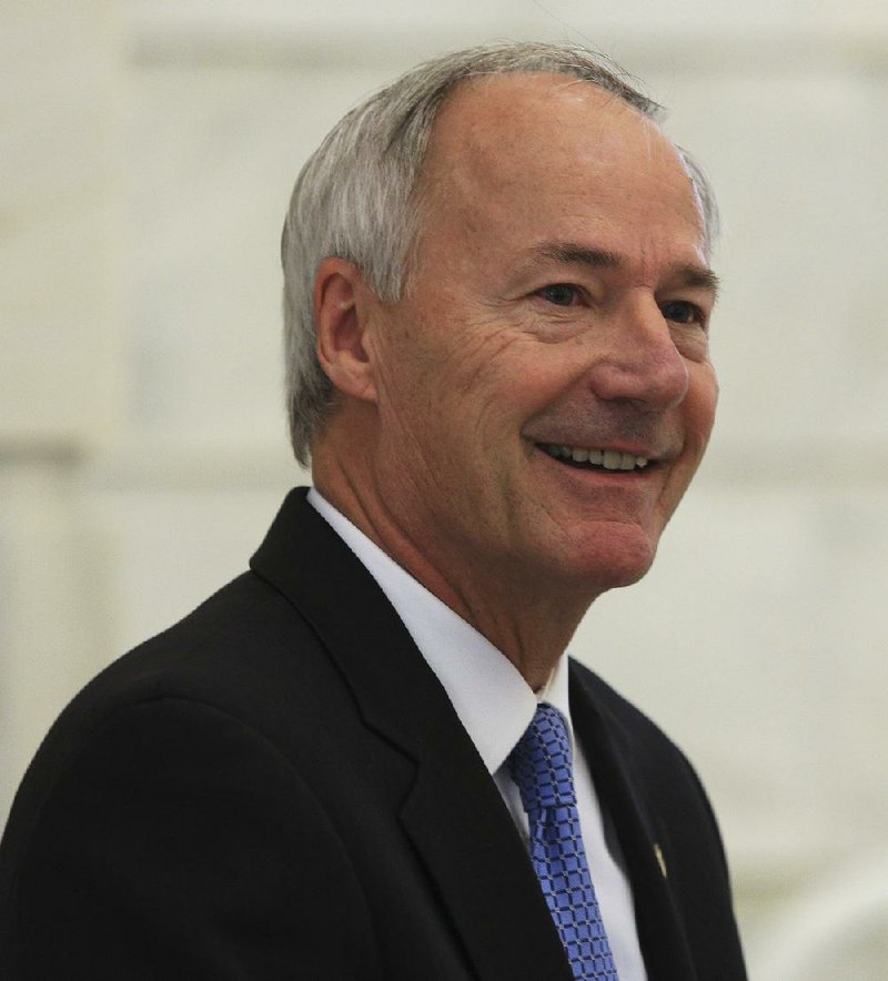  Arkansas Democrat-Gazette/STATON BREIDENTHAL --11/25/14-- Arkansas Gov.-elect Asa Hutchinson speaks Tuesday at a news conference at the state Capitol in Little Rock.