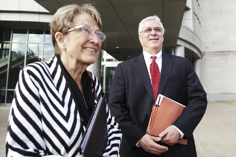 Attorney Cheryl Maples, left, and her colleague attorney Jack Wagoner leave federal court in Little Rock, Ark., Thursday, Nov. 20, 2014. The two lawyers for same-sex couples argued against Arkansas' gay marriage ban in front of a federal judge Thursday. (AP Photo/Danny Johnston)