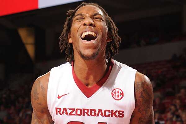 Arkansas' Michael Qualls celebrates against Northwestern State during the first half Sunday, Dec. 28, 2014, in Bud Walton Arena in Fayetteville.