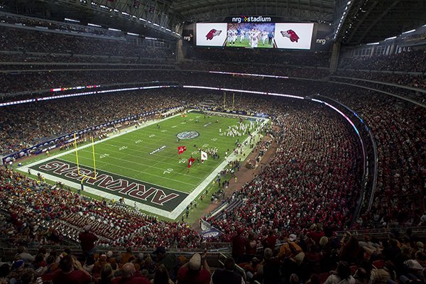 Arkansas players take the field prior to the Texas Bowl on Monday, Dec. 29, 2014 at NRG Stadium in Houston. 