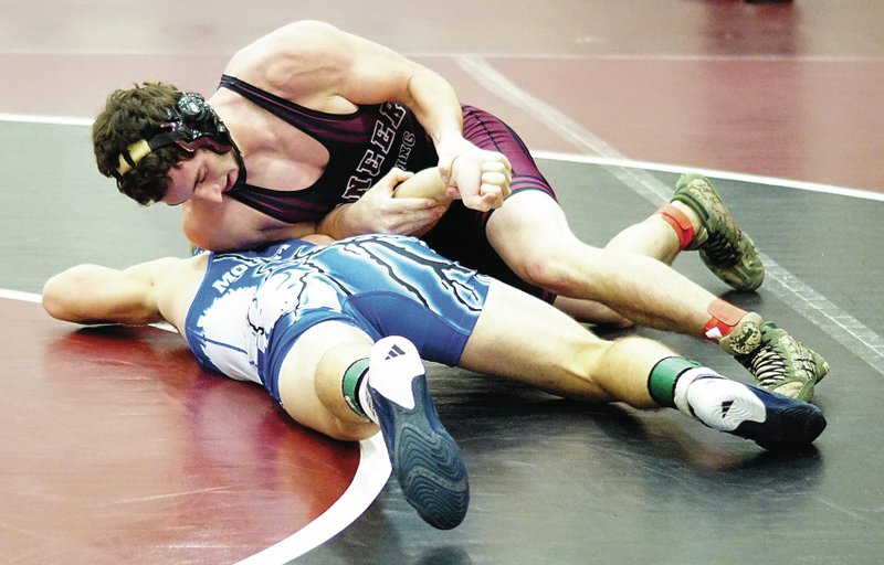 Photo by Randy Moll Gentry wrestler Cody Watson works the arm of his opponent during the championsip rounds of the Pioneer Classic wrestling tournament held at Gentry High School on Dec. 20.