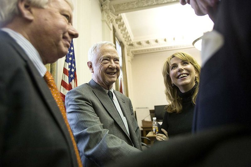 Pulaski County Circuit Judge Collins Kilgore (center) greets friends of Clerk Kathleen Pitcock, (second from right) who has clerked for Kilgore for nearly 13 years, during his retirement party at the county courthouse Dec. 18. Kilgore’s last day as a jurist was Wednesday. 