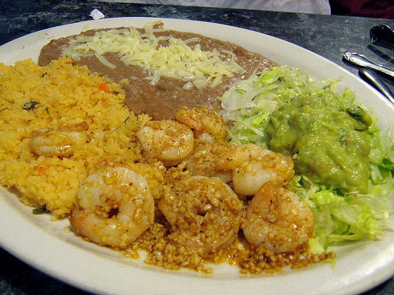 An order of Camarones Al Mojo De Ajo at Mi Ranchito in Cabot features tender shrimp in a minced garlic sauce, served with rice and beans. 