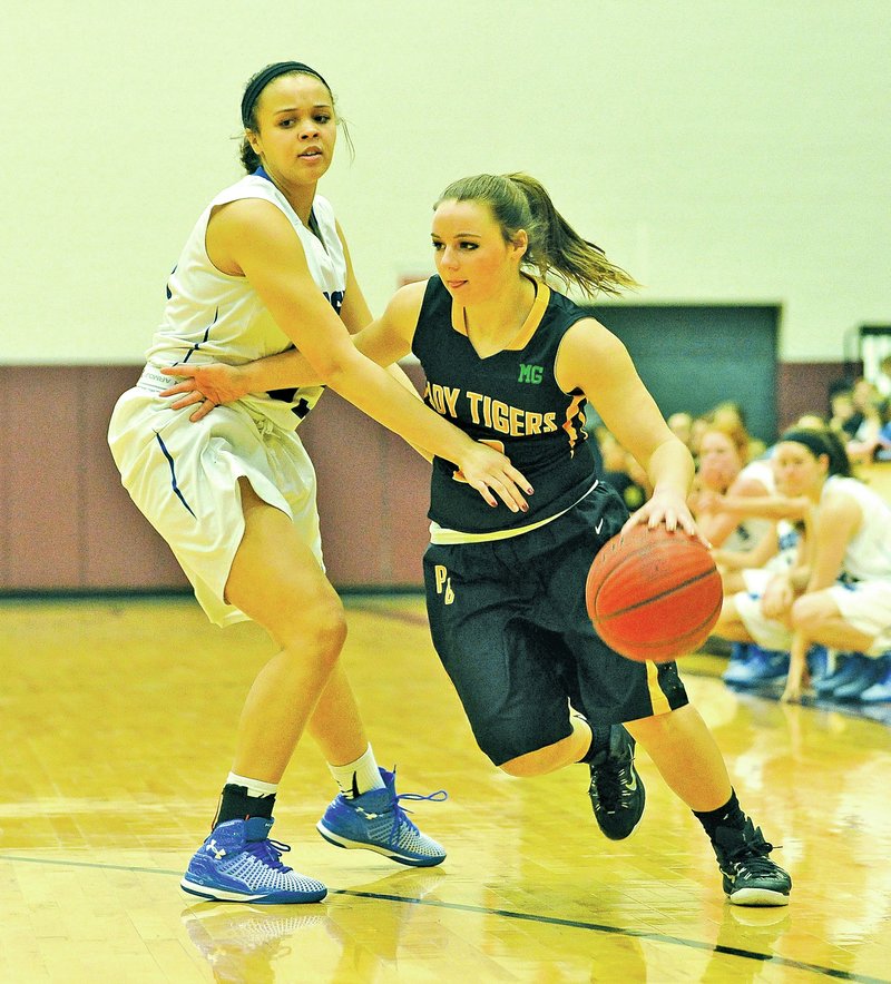  Staff Photo Michael Woods Camree Bartholomew, right, of Prairie Grove drives the ball past Rogers High&#8217;s Mykelle Williams during Friday&#8217;s game during the Siloam Springs Holiday Classic basketball tournament in Siloam Springs.