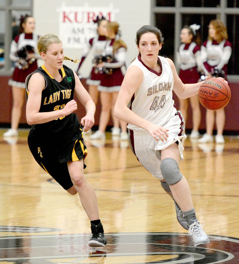 Bud Sullins/Special to NWA Media Siloam Springs senior Baily Cameron brings the ball up the floor past Prairie Grove&#8217;s Ashley Cox during Saturday&#8217;s finals of the Siloam Springs Holiday Classic.