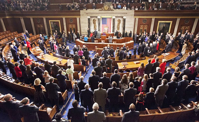 The Associated Press New members: Members of the House of Representatives stand for the Pledge of Allegiance during the opening session of the 114th Congress, on Capitol Hill in Washington Tuesday, as Republicans assume full control for the first time in eight years.
