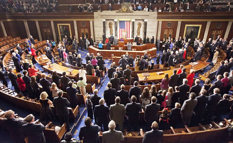 The Associated Press New members: Members of the House of Representatives stand for the Pledge of Allegiance during the opening session of the 114th Congress, on Capitol Hill in Washington Tuesday, as Republicans assume full control for the first time in eight years.
story.lead_photo.caption