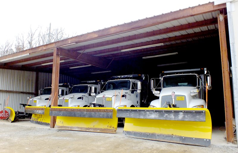 Brandon Howard/The Weekly Vista A fleet of four Kenworth T370s sit in a garage at the Street Department on Dec. 31. There are 14 trucks in total at the department&#8217;s disposal &#8212; six light trucks and eight heavy trucks. If a winter snow storm blankets the city, Street Department officials said they&#8217;ll use these trucks to plow the more than 500 miles of city streets.