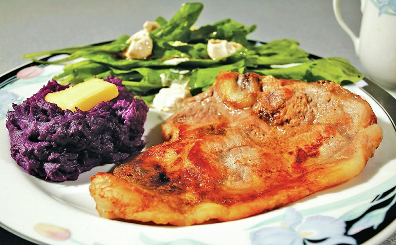 STAFF PHOTO David Gottschalk A meal can be born almost entirely from ingredients found at the winter market presented by the Fayetteville Farmers&#8217; Market. Pictured are a pork chop, a simple arugula salad with fresh cheese and purple sweet potatoes.