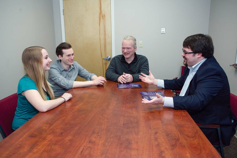 Independent Living Services consumer James Plaxco, center, listens to Brittany Crawford, from left, John Schultz and Jordan Dunn, all of whom work with the new program, Community Access Supported Employment. ILS, at 615 E. Robins St. in Conway, received a grant to help people with intellectual and/or physical disabilities find full- or part-time jobs in the community, and the program provides follow-up services. More information is available by calling (501) 327-5234.