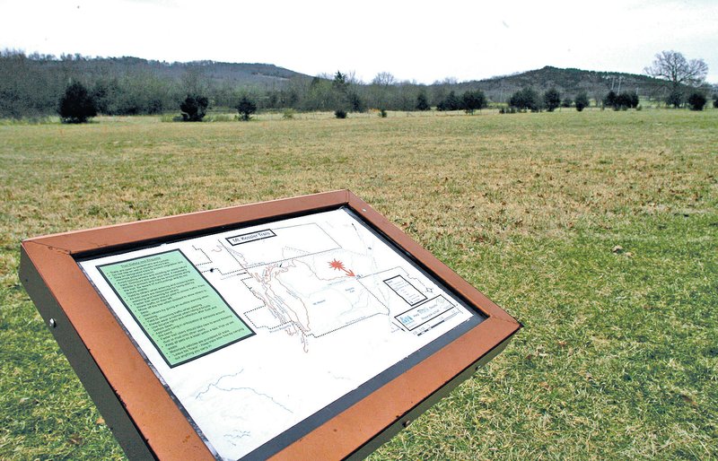 STAFF PHOTO DAVID GOTTSCHALK A view north from the trailhead at the site of Fayetteville&#8217;s Regional Park off Cato Springs Road in Fayetteville. Jerry Jones, owner of the Dallas Cowboys and a University of Arkansas alumnus, bought 250 acres in southwest Fayetteville and donated it to a company affiliated with Sean Rochelle, executive director of the Razorback Foundation. The land is next to the site of Fayetteville&#8217;s planned regional park and the Mount Kessler Reserve, which the city bought in March using a grant from the Walton Family Foundation.