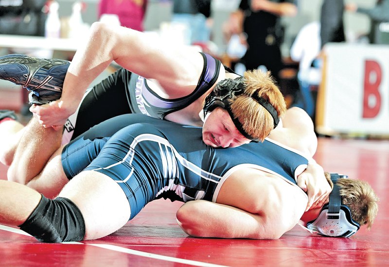  FILE PHOTO JASON IVESTER Dane Shields, top, of Fayetteville and Greenwood&#8217;s Bryce Allen grapple in the 160-weight class during the Big West Conference Tournament on Jan. 25, 2014, at Springdale High.