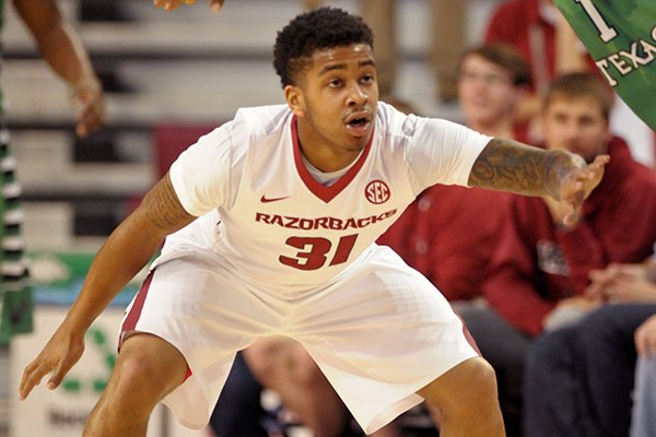 Arkansas guard Anton Beard guards Maurice Aniefiok of North Texas during a game Friday, Nov. 28, 2014 at Bud Walton Arena in Fayetteville. 