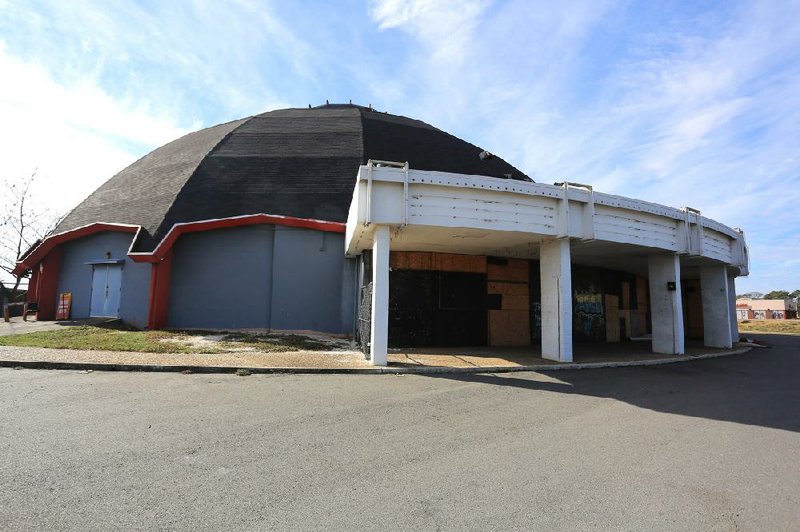 The boarded-up Cinema 150 at the Village Shopping Center in Little Rock has been vacant for several years and is described as functionally obsolete. 