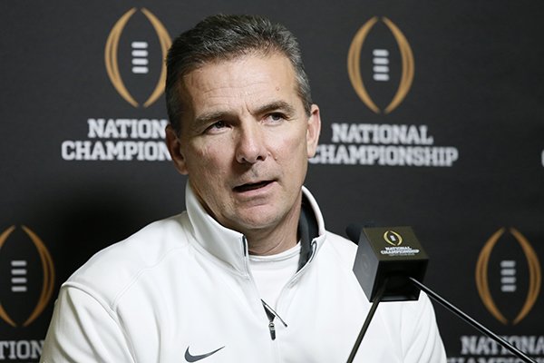 Ohio State head coach Urban Meyer responds to a question during media day for the NCAA college football playoff championship, Saturday, Jan. 10, 2015, in Dallas. Ohio State is scheduled to play Oregon on Monday. (AP Photo/Tony Gutierrez)