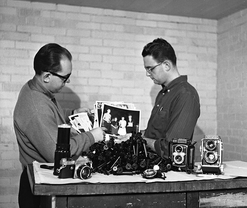 Courtesy Photo Shiloh Museum of Ozark History Photographer Charles Bickford, left, and Jim Morriss, longtime editor of The Springdale News and The Morning News, show off new cameras in December 1965.