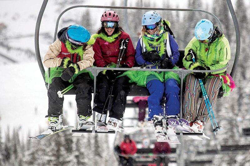 Ann Schorling, Jill Sassi, Kelly Mecartney and Sasha Zolikon, all of Jackson, Wyo., ride the Sublette Quad Chair lift at Jackson Hole Mountain Resort in Teton Village, Wyo. These days Jackson Hole is appealing to a broader clientele with the development of luxury hotels, children’s and family programs and other amenities. 