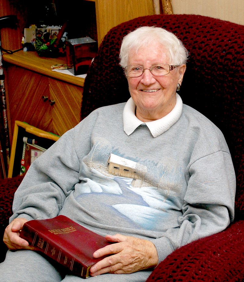 Photo by Janelle Jessen Emily Montgomery sat in her cozy living room holding the Bible where she keeps her family records. She has nine children, 22 grandchildren, 52 great-grandchildren and 12 great-great-grandchildren.