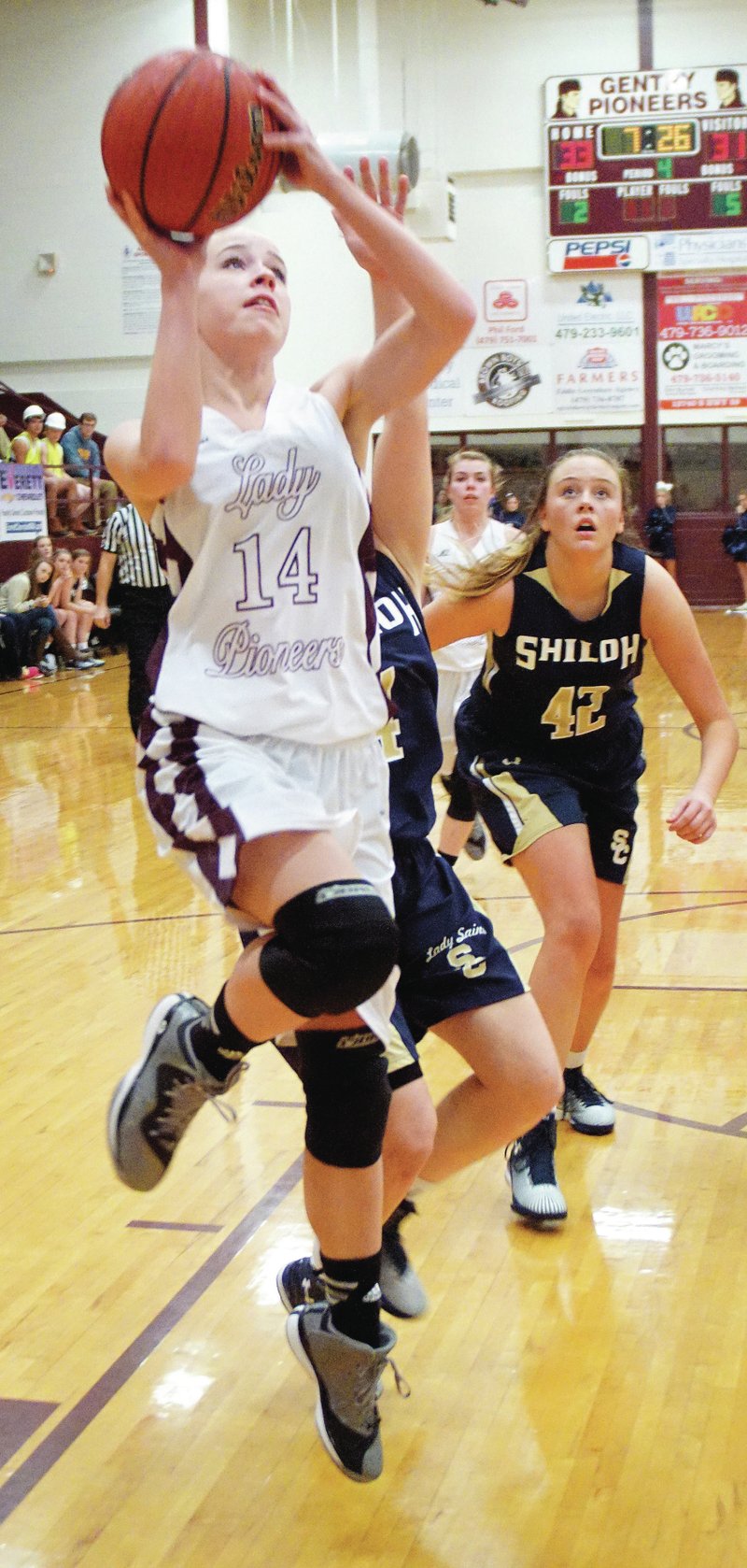 Photo by Randy Moll Amber Ellis goes up for two in play against Shiloh Christian on Friday night at Gentry High School.