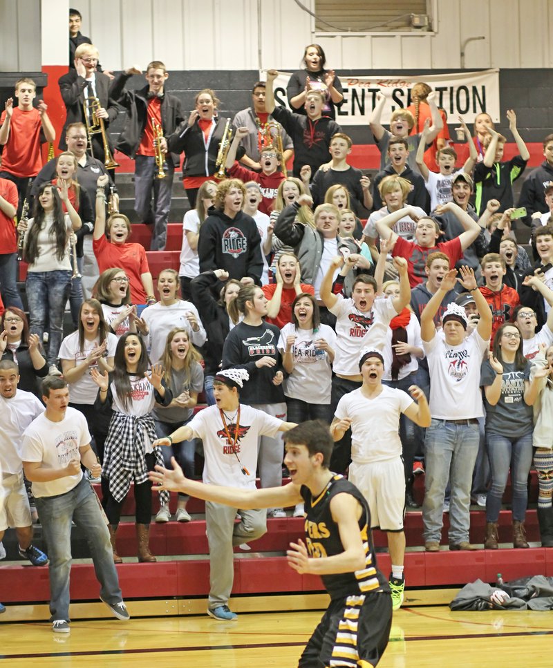 Photography by Russ Wilson Elated Blackhawk fans cheered as the boys varsity basketball team won their game Friday night in Blackhawk gym. Editor&#8217;s note: Wilson Creations at 479-633-1365 or its2ez4me2hr@yahoo.com. Check out Wilson Creations on Facebook at www.facebook.com/wilsoncreations or visit his Web site at www.wilsoncreations.com.