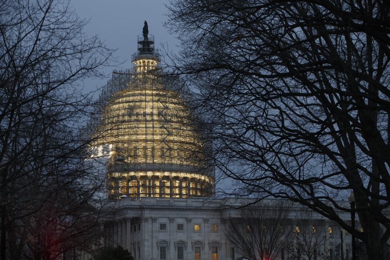 This Jan. 9, 2015 file photo shows the Capitol in Washington. The Treasury Department releases federal budget data for December on Tuesday, Jan. 13, 2015.