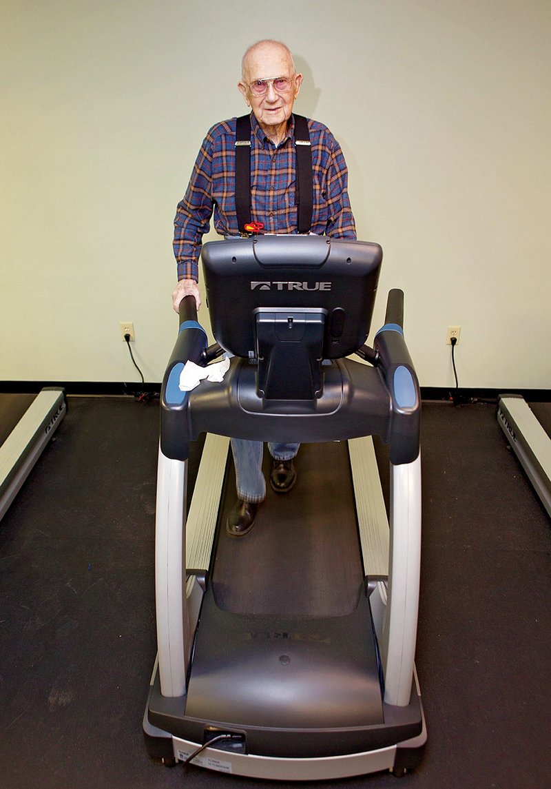 Burlie Thomas, who will be 98 years old in March, walks a mile five days a week on a treadmill in The Ola and John Hawks Senior Wellness and Activity Center in Conway. He also plays on the center’s championship beanbag-baseball team and is the star player, said Debra Robinson, executive director of the Faulkner County Senior Citizens Program. Thomas said the center keeps him going strong by providing social and physical activities.