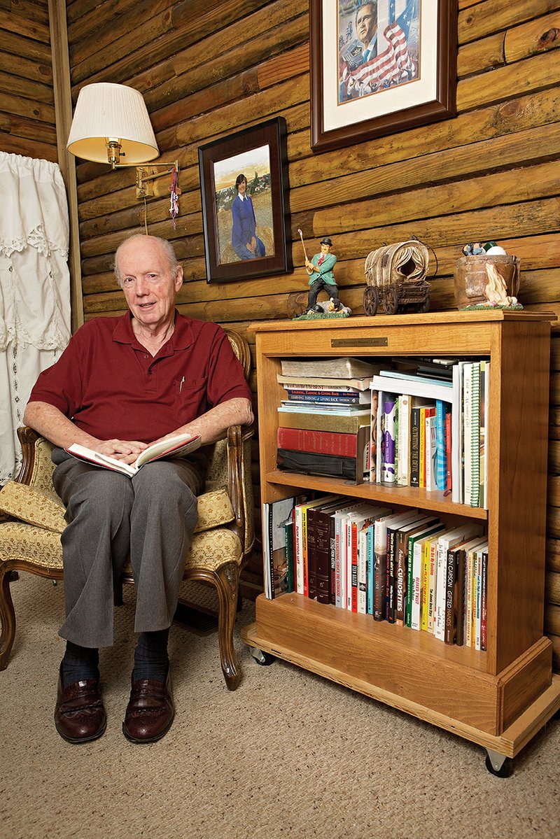 Jim Davidson, who started A Bookcase for Every Child in 2005, is shown with one of his bookshelves.