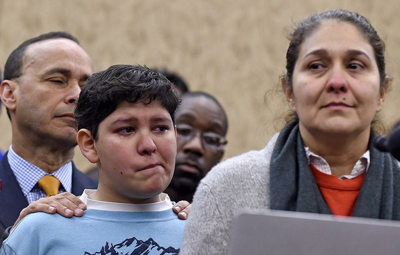 Rep. Luis Gutierrez (left), D-Ill., joins a news conference Wednesday on Capitol Hill with Isabel Aguilar and her son, Adolofo Martinez, 13, to speak out against House Republicans’ immigration policies. Gutierrez warned Republicans that they were igniting “the mobilization of an immigrant community throughout this nation that will be the death knell to the future of your party.” 