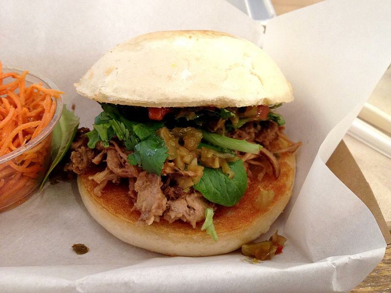 Three Fold diners can choose chopped pork (shown), chopped chicken or tofu on fluffy buns, with a side of carrot or cucumber slaw. 