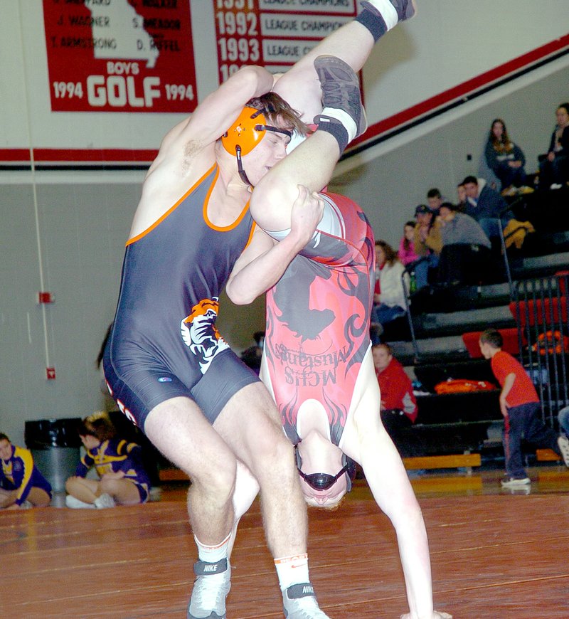 RICK PECK MCDONALD COUNTY PRESS McDonald County&#8217;s Kyle Hall is taken head over heels by Republic&#8217;s Zack Dickens in a 195-pound match Jan. 8 at MCHS. Dickens later went on to win the match by pin.