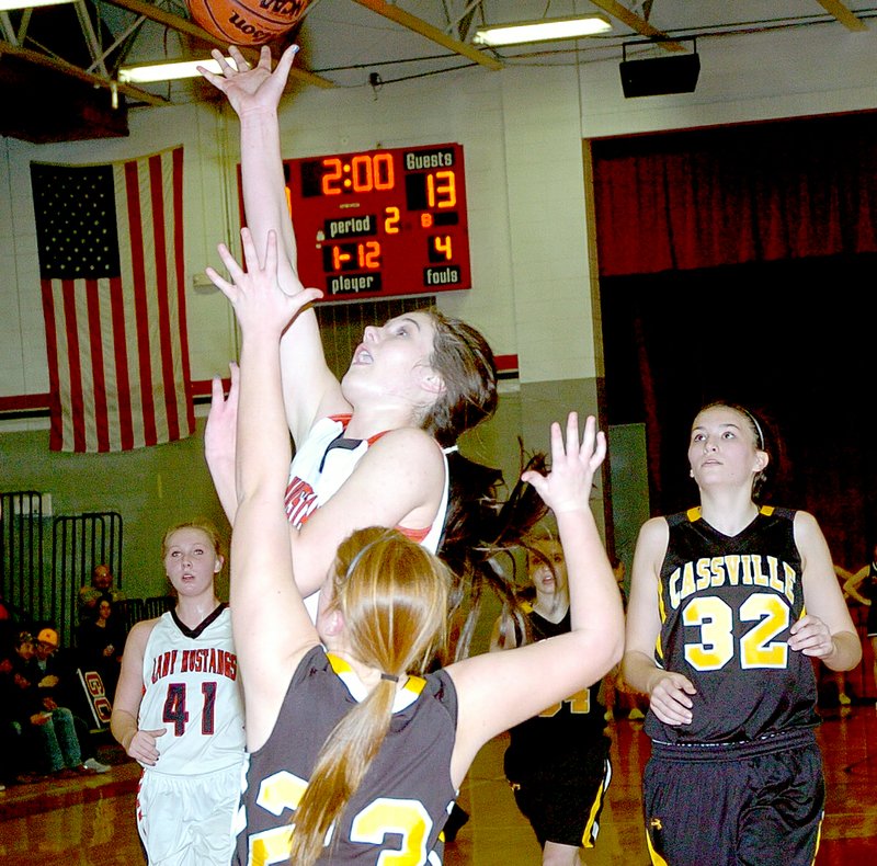 RICK PECK MCDONALD COUNTY PRESS McDonald County&#8217;s Preslea Reece scores two of her game-high 22 points during the Lady Mustangs 61-23 win Monday night at MCHS.