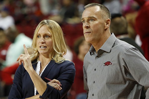 Arkansas coach Jimmy Dykes, right, and assistant coach Christy Smith speak during a game against Nicholls State on Friday, Nov. 14, 2014 at Bud Walton Arena in Fayetteville. 