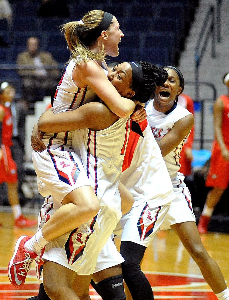 Ole Miss forward Shequila Joseph (right) and guard Gracie Frizzell (Central Arkansas Christian) celebrate following the Rebels’ 55-52 victory over No. 18 Georgia on Thursday in Oxford, Miss.