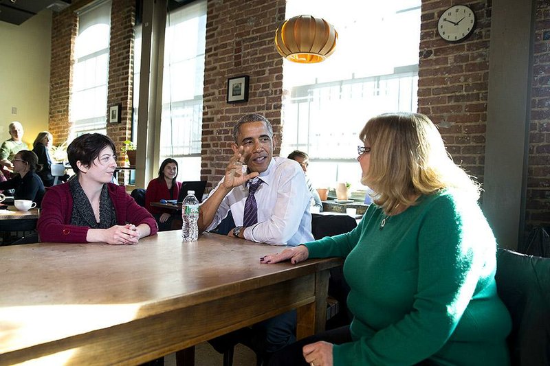 President Barack Obama chats in Baltimore with Amanda Rothschild (left) and Mary Stein about proposals on paid sick leave for working Americans. Earlier, the president signed a memorandum to direct federal agencies to advance six weeks of sick leave that workers could use as paid family leave. 