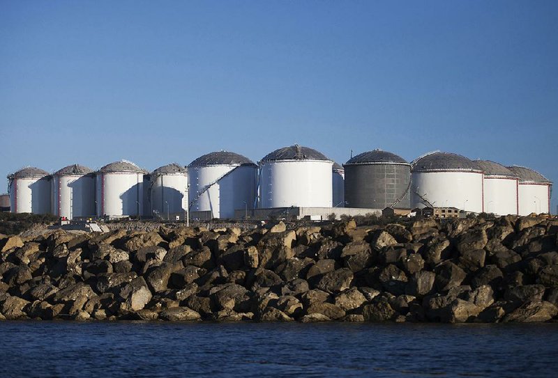 These shoreline fuel storage tanks in Vasilikos, Cyprus, belong to the VTTV oil storage terminal. Analysts say finding long-term storage for crude is one strategy traders are using to survive the recent fall of oil prices. 