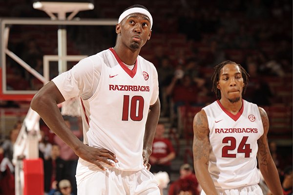 Bobby Portis (10) and Michael Qualls of Arkansas react during the final minute against Mississippi during the second half of play Saturday, Jan. 17, 2015, in Bud Walton Arena in Fayetteville.