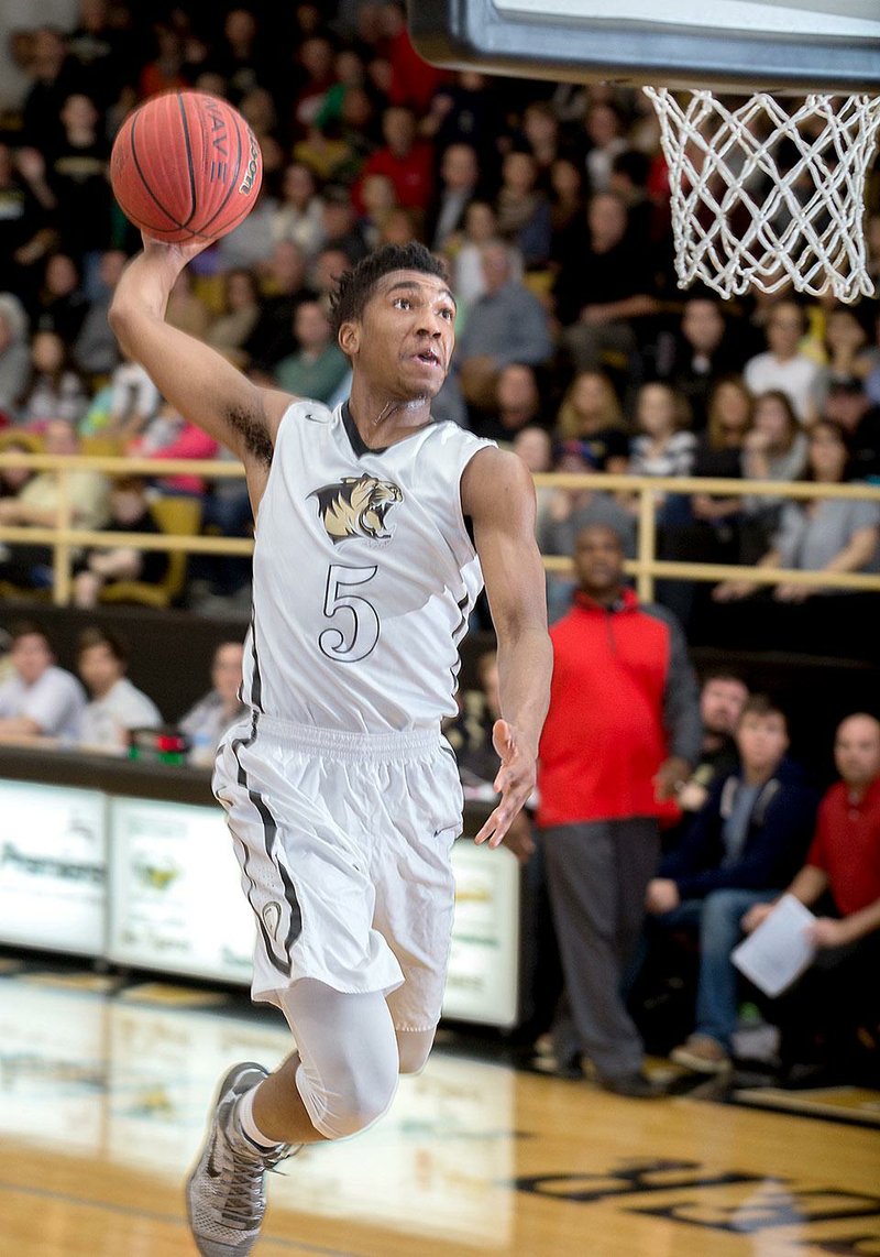 Bentonville junior Malik Monk scores two of his 38 points against Fort Smith Northside during a game on Jan. 13. Monk scored 50 for the Tigers on Saturday in a loss to Chino Hills, Calif., at the Bass Pro Shops Tournament of Champions at Missouri State in Springfield, Mo. 