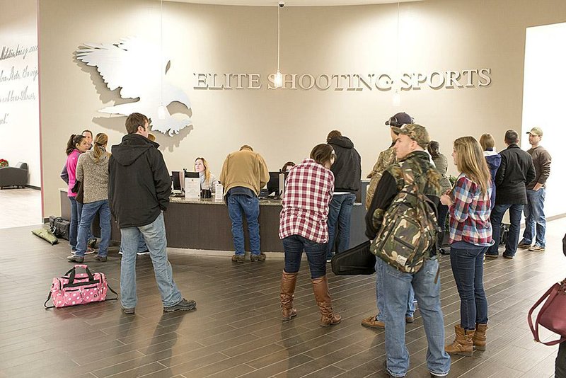 Customers line up to spend a recent morning on the gun ranges at Elite Shooting Sports in Manassas, Va. “We wanted to be more open and inviting for families, to appeal to everyone. This is not your stereotypical range,” said range founder Greg Wodack. 